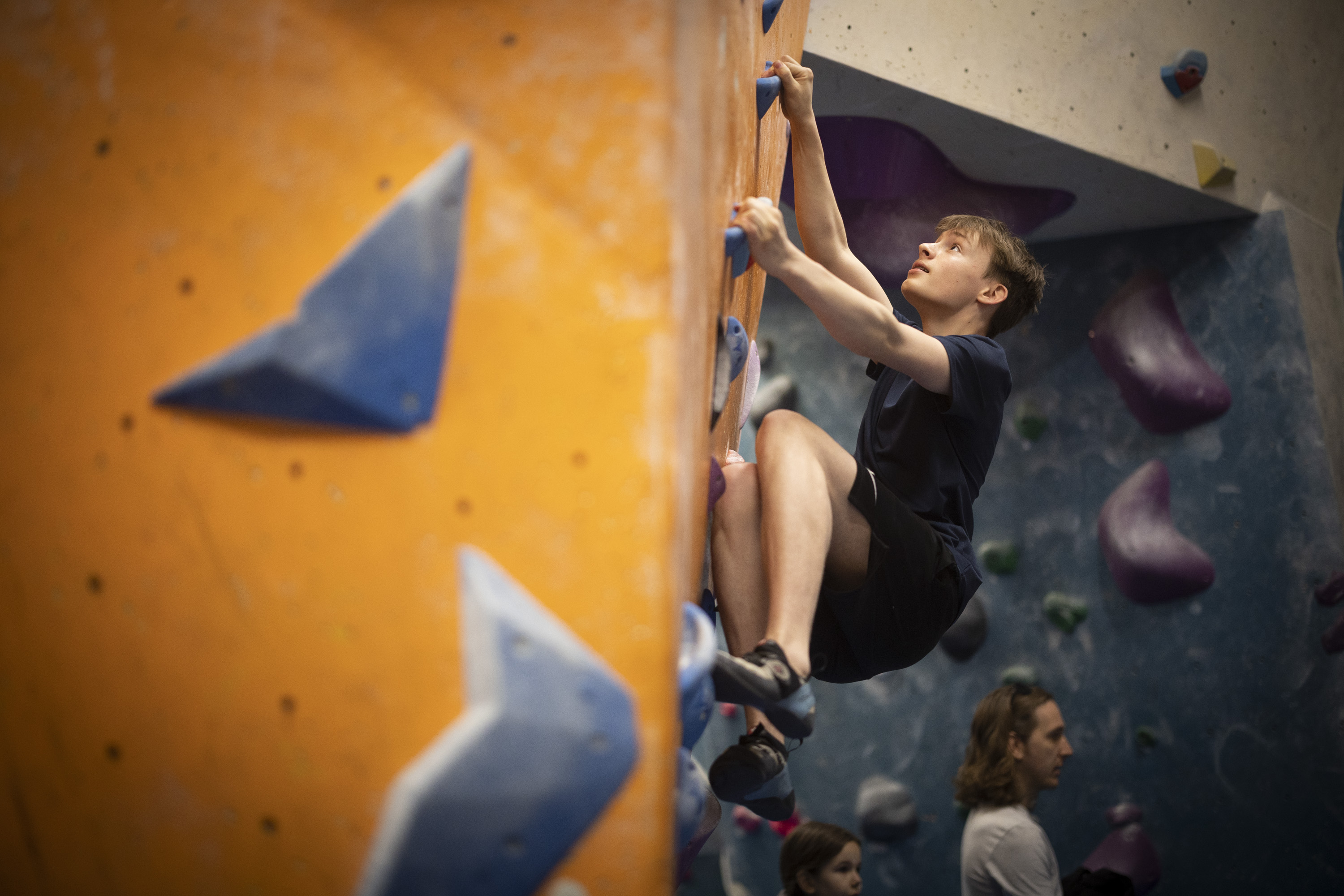 Young climber bouldering at The Reach Youth Academy